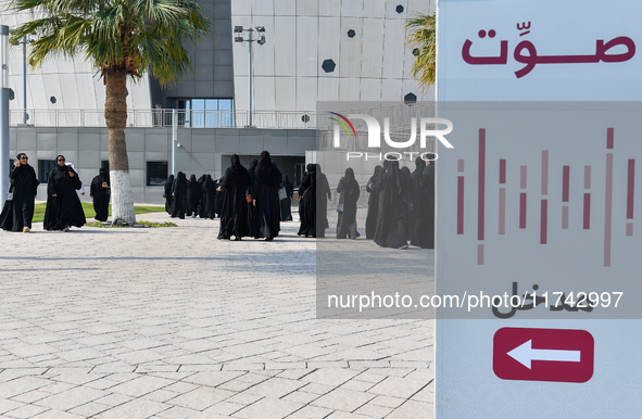 Qatari women arrive at a polling station in Doha, Qatar, on November 5, 2024, to cast their votes in a general referendum on constitutional...