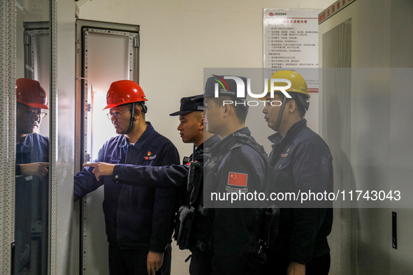 Border police conduct an enterprise safety inspection on a wind power plant in Altay, Xinjiang, China, on November 5, 2024. 