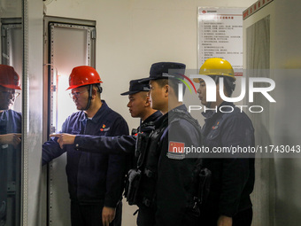 Border police conduct an enterprise safety inspection on a wind power plant in Altay, Xinjiang, China, on November 5, 2024. (