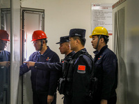 Border police conduct an enterprise safety inspection on a wind power plant in Altay, Xinjiang, China, on November 5, 2024. (