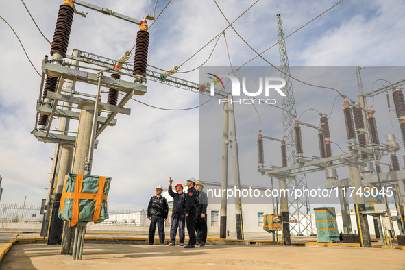 Border police conduct an enterprise safety inspection on a wind power plant in Altay, Xinjiang, China, on November 5, 2024. 