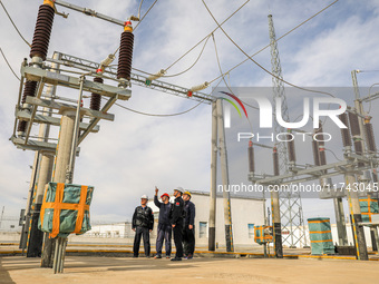 Border police conduct an enterprise safety inspection on a wind power plant in Altay, Xinjiang, China, on November 5, 2024. (