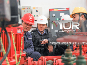 Border police conduct an enterprise safety inspection on a wind power plant in Altay, Xinjiang, China, on November 5, 2024. (