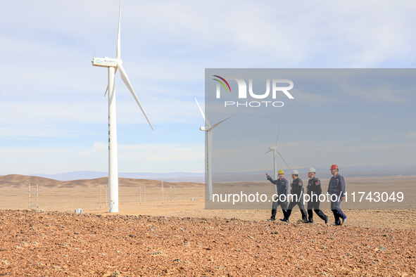 Border police conduct an enterprise safety inspection on a wind power plant in Altay, Xinjiang, China, on November 5, 2024. 