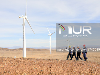 Border police conduct an enterprise safety inspection on a wind power plant in Altay, Xinjiang, China, on November 5, 2024. (