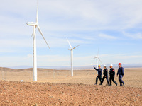 Border police conduct an enterprise safety inspection on a wind power plant in Altay, Xinjiang, China, on November 5, 2024. (