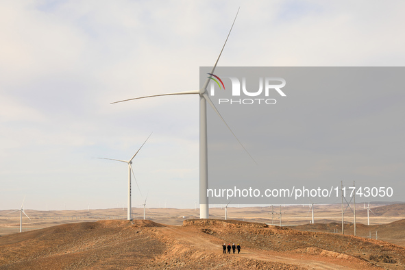 Border police conduct an enterprise safety inspection on a wind power plant in Altay, Xinjiang, China, on November 5, 2024. 