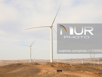 Border police conduct an enterprise safety inspection on a wind power plant in Altay, Xinjiang, China, on November 5, 2024. (