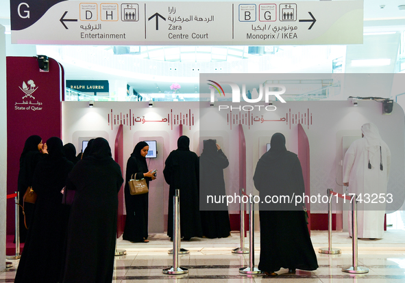 Qatari voters cast their electronic votes at a polling station in Doha, Qatar, on November 5, 2024, in a general referendum on constitutiona...