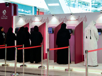 Qatari voters cast their electronic votes at a polling station in Doha, Qatar, on November 5, 2024, in a general referendum on constitutiona...