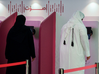 Qatari voters cast their electronic votes at a polling station in Doha, Qatar, on November 5, 2024, in a general referendum on constitutiona...