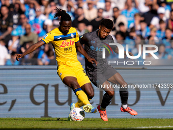 Odilon Kossounou of Atalanta BC and David Neres of SSC Napoli compete for the ball during the serie Serie A Enilive match between SSC Napoli...