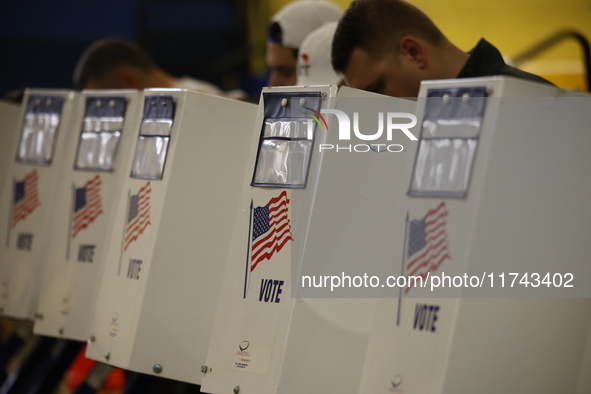 Americans cast their ballots in the presidential election in downtown New York, United States, on November 5, 2024, at the Institute of Art...