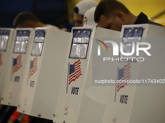 Americans cast their ballots in the presidential election in downtown New York, United States, on November 5, 2024, at the Institute of Art...