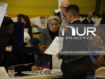 Americans cast their ballots in the presidential election in downtown New York, United States, on November 5, 2024, at the Institute of Art...