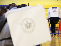 Americans cast their ballots in the presidential election in downtown New York, United States, on November 5, 2024, at the Institute of Art...