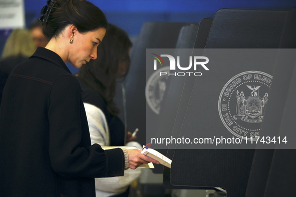 Americans cast their ballots in the presidential election in downtown New York, United States, on November 5, 2024, at the Institute of Art...