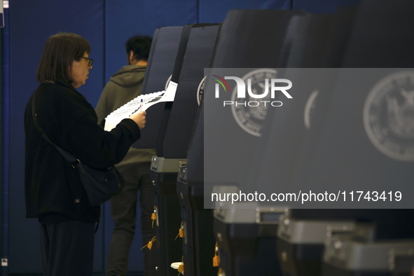 Americans cast their ballots in the presidential election in downtown New York, United States, on November 5, 2024, at the Institute of Art...