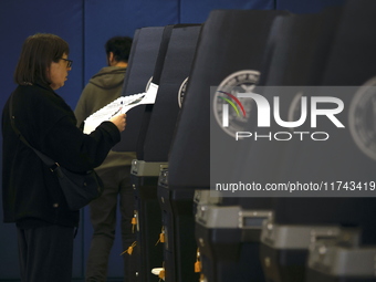 Americans cast their ballots in the presidential election in downtown New York, United States, on November 5, 2024, at the Institute of Art...