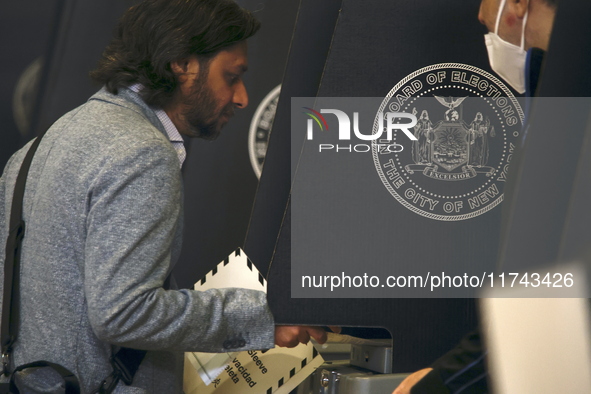 Americans cast their ballots in the presidential election in downtown New York, United States, on November 5, 2024, at the Institute of Art...