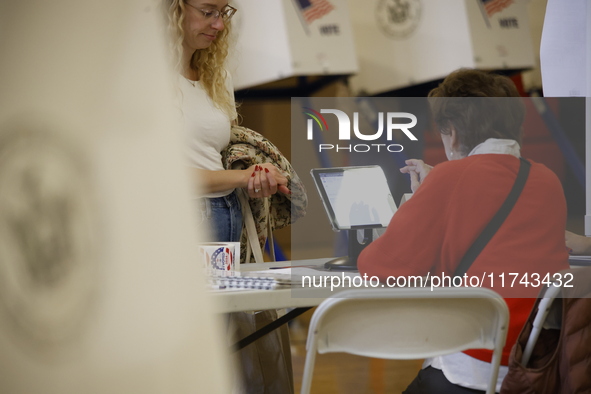 Americans cast their ballots in the presidential election in downtown New York, United States, on November 5, 2024, at the Institute of Art...