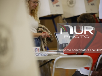 Americans cast their ballots in the presidential election in downtown New York, United States, on November 5, 2024, at the Institute of Art...