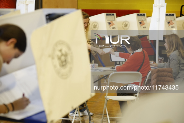 Americans cast their ballots in the presidential election in downtown New York, United States, on November 5, 2024, at the Institute of Art...