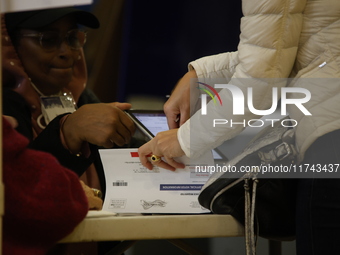 Americans cast their ballots in the presidential election in downtown New York, United States, on November 5, 2024, at the Institute of Art...