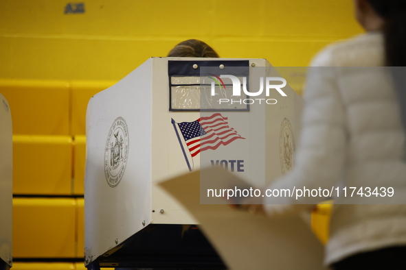 Americans cast their ballots in the presidential election in downtown New York, United States, on November 5, 2024, at the Institute of Art...