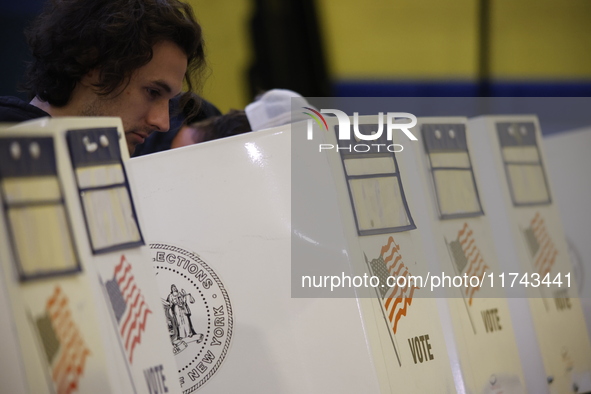 Americans cast their ballots in the presidential election in downtown New York, United States, on November 5, 2024, at the Institute of Art...