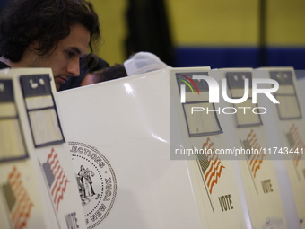 Americans cast their ballots in the presidential election in downtown New York, United States, on November 5, 2024, at the Institute of Art...