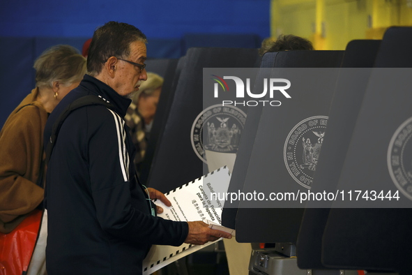 Americans cast their ballots in the presidential election in downtown New York, United States, on November 5, 2024, at the Institute of Art...