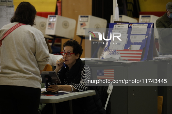 Americans cast their ballots in the presidential election in downtown New York, United States, on November 5, 2024, at the Institute of Art...