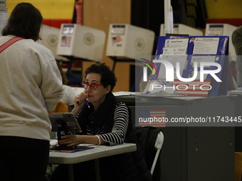 Americans cast their ballots in the presidential election in downtown New York, United States, on November 5, 2024, at the Institute of Art...