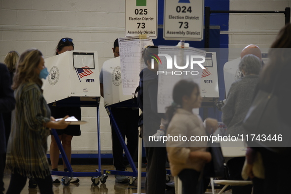 Americans cast their ballots in the presidential election in downtown New York, United States, on November 5, 2024, at the Institute of Art...