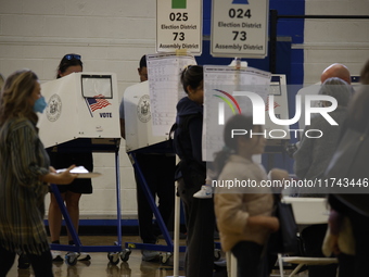 Americans cast their ballots in the presidential election in downtown New York, United States, on November 5, 2024, at the Institute of Art...