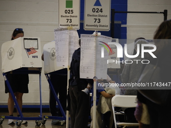 Americans cast their ballots in the presidential election in downtown New York, United States, on November 5, 2024, at the Institute of Art...