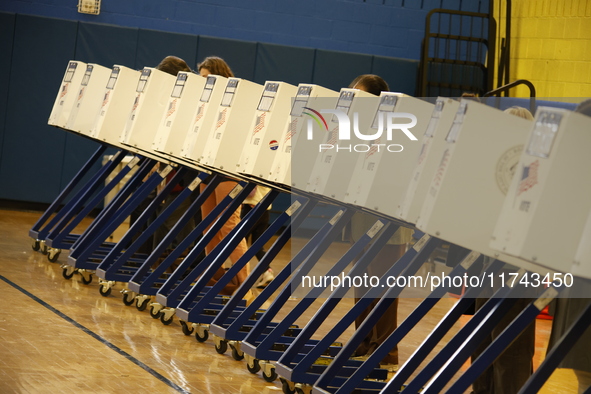 Americans cast their ballots in the presidential election in downtown New York, United States, on November 5, 2024, at the Institute of Art...