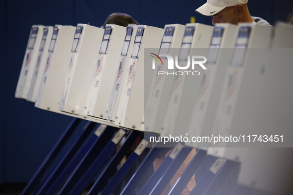 Americans cast their ballots in the presidential election in downtown New York, United States, on November 5, 2024, at the Institute of Art...