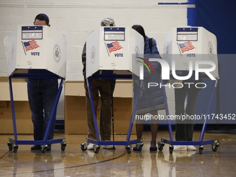 Americans cast their ballots in the presidential election in downtown New York, United States, on November 5, 2024, at the Institute of Art...