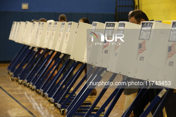 Americans cast their ballots in the presidential election in downtown New York, United States, on November 5, 2024, at the Institute of Art...