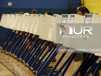 Americans cast their ballots in the presidential election in downtown New York, United States, on November 5, 2024, at the Institute of Art...