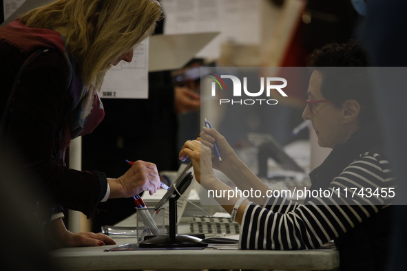 Americans cast their ballots in the presidential election in downtown New York, United States, on November 5, 2024, at the Institute of Art...