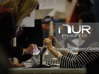 Americans cast their ballots in the presidential election in downtown New York, United States, on November 5, 2024, at the Institute of Art...