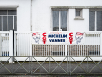 A CGT union banner reads ''closure, angry employees, job losses'' in front of the Michelin plant in Vannes, France, on November 5, 2024. Mic...