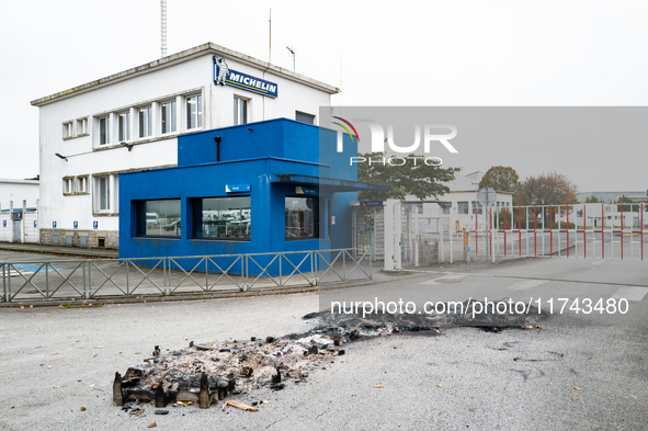 CGT union representatives and workers burn tires during a demonstration in front of the Michelin plant in Vannes, France, on November 5, 202...