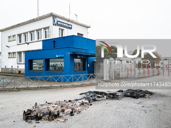 CGT union representatives and workers burn tires during a demonstration in front of the Michelin plant in Vannes, France, on November 5, 202...