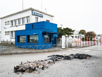 CGT union representatives and workers burn tires during a demonstration in front of the Michelin plant in Vannes, France, on November 5, 202...