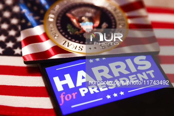 'Harris for President' sign is displayed on a mobile phone screen with US flag in the background for illustration photo. Krakow, Poland on N...