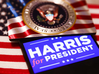 'Harris for President' sign is displayed on a mobile phone screen with US flag in the background for illustration photo. Krakow, Poland on N...